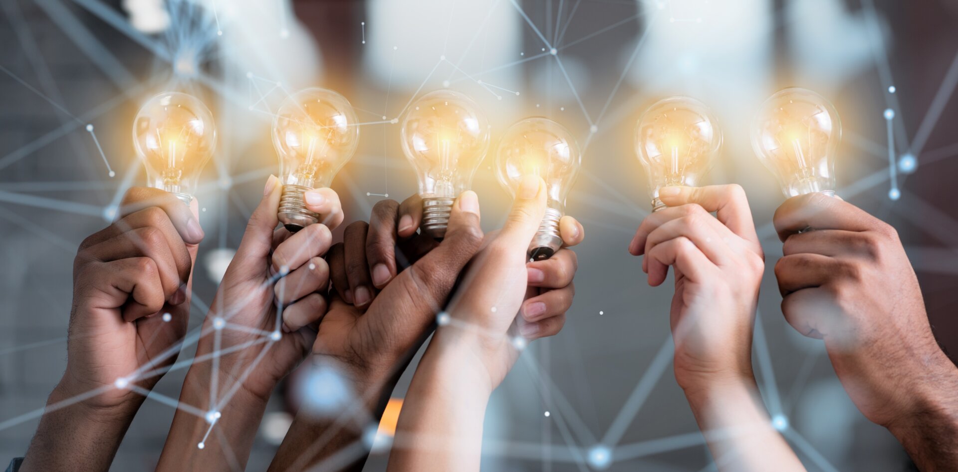 Teamwork and brainstorming concept with businessmen that share an idea with a lamp. Concept of startup