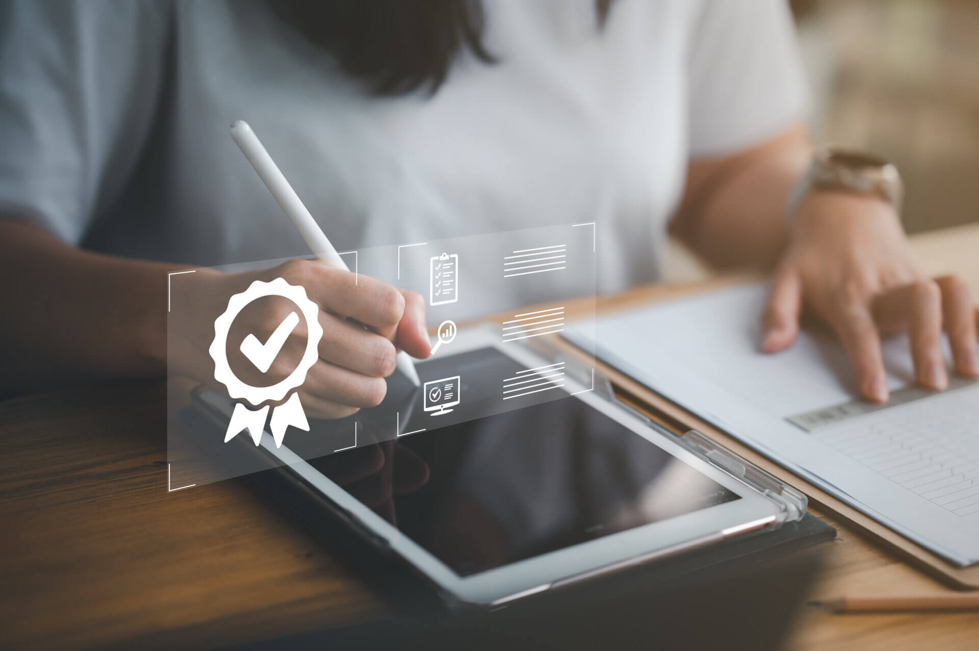 businesswoman working on tablet with sign of the top service Quality assurance, Guarantee, Standards, ISO certification and standardization concept.