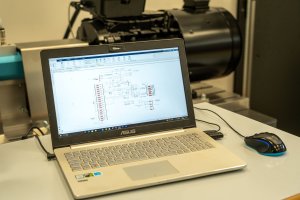 Drive Test Bench System for Hardware Simulation of Interaction Between a Drive/Source and the Power Grid