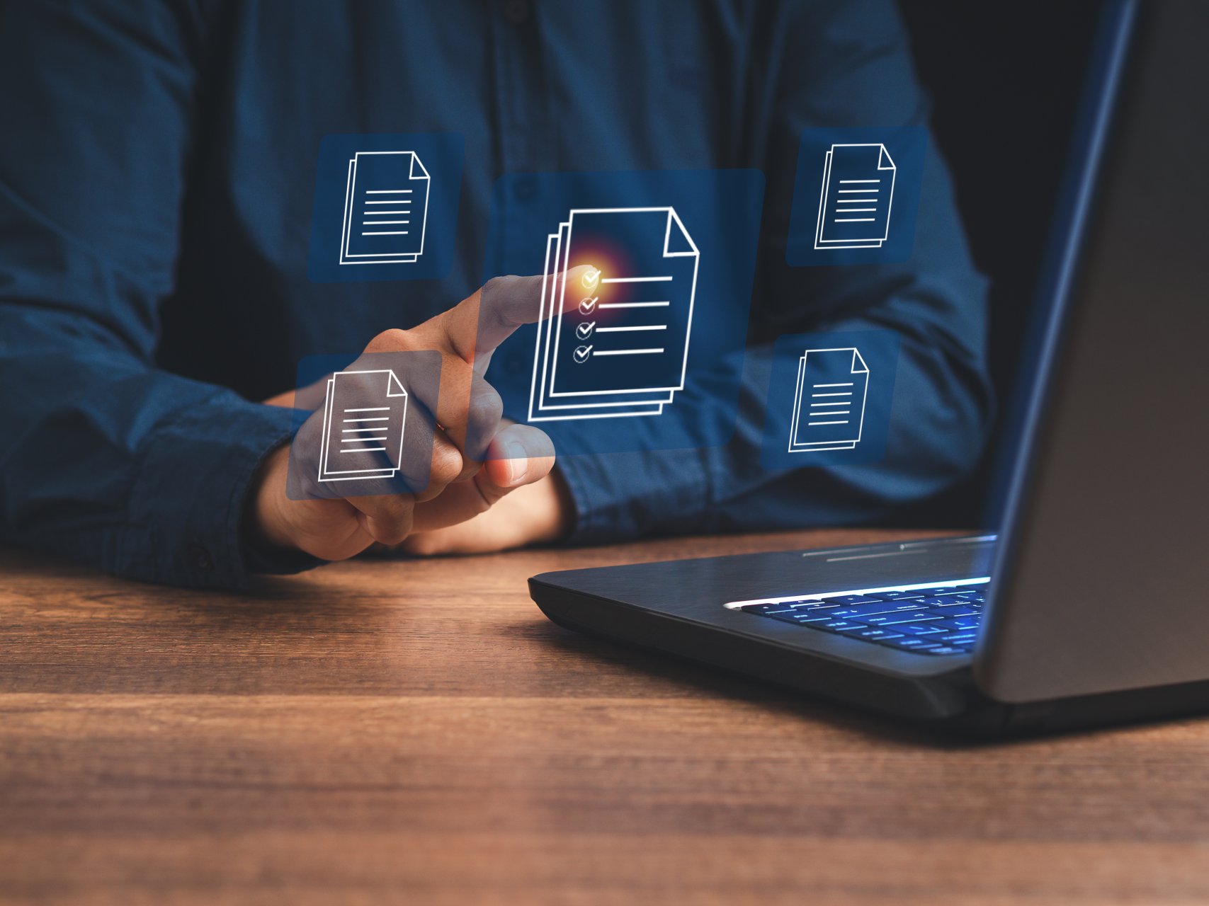 Businessman working at a laptop and digital documents with check